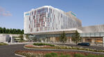 Architectural rendering of a modern multistory Geisinger hospital tower with a curved glass facade, copper-colored accent panels, and a white cantilevered canopy over the main entrance, fronted by a circular driveway with landscaped islands and pedestrians walking nearby.