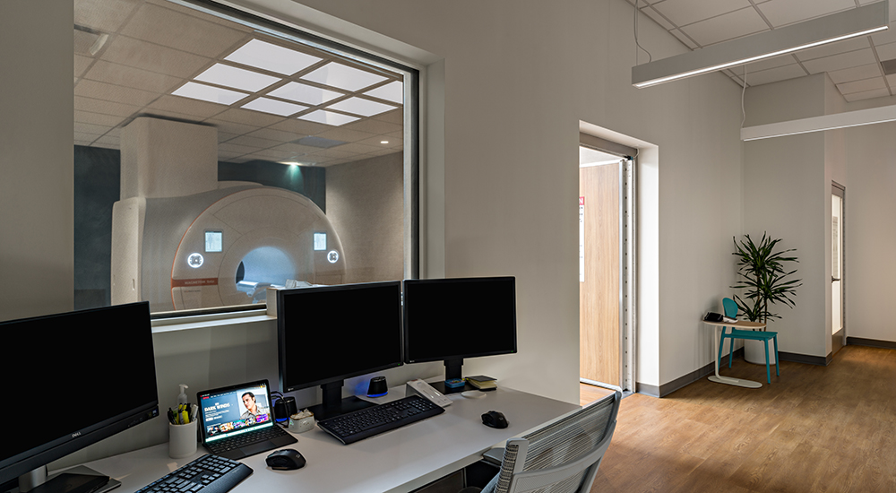 MRI technician station and scan room at Prenuvo whole body MRI scan clinic in St. Petersburg, Fla.